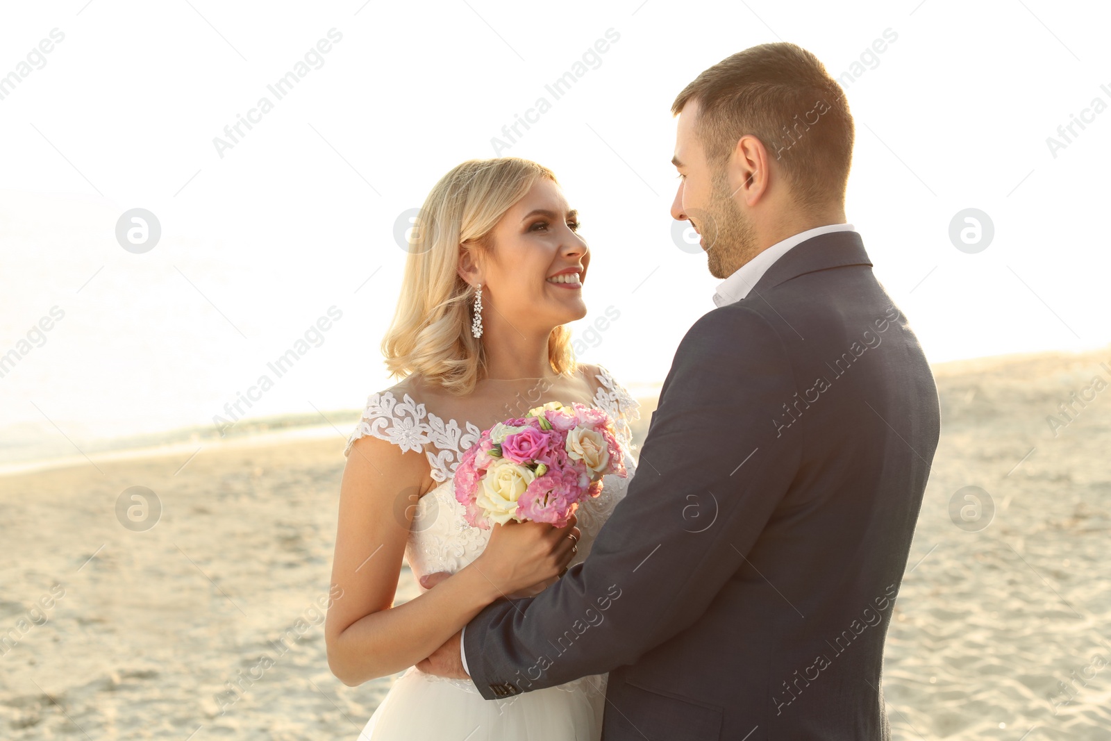 Photo of Wedding couple. Bride and groom on beach