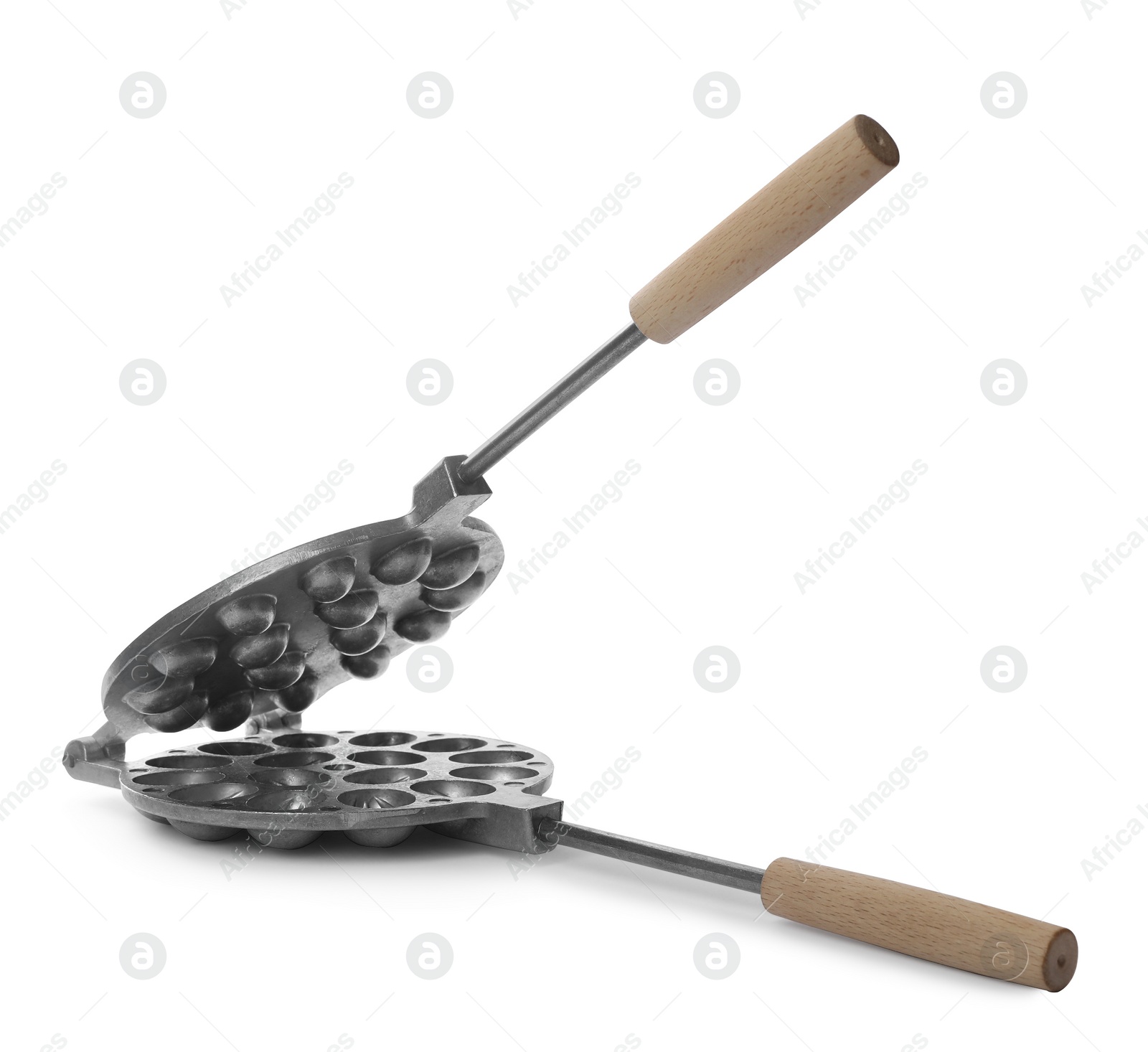 Photo of Walnut cookie mold with wooden handle isolated on white