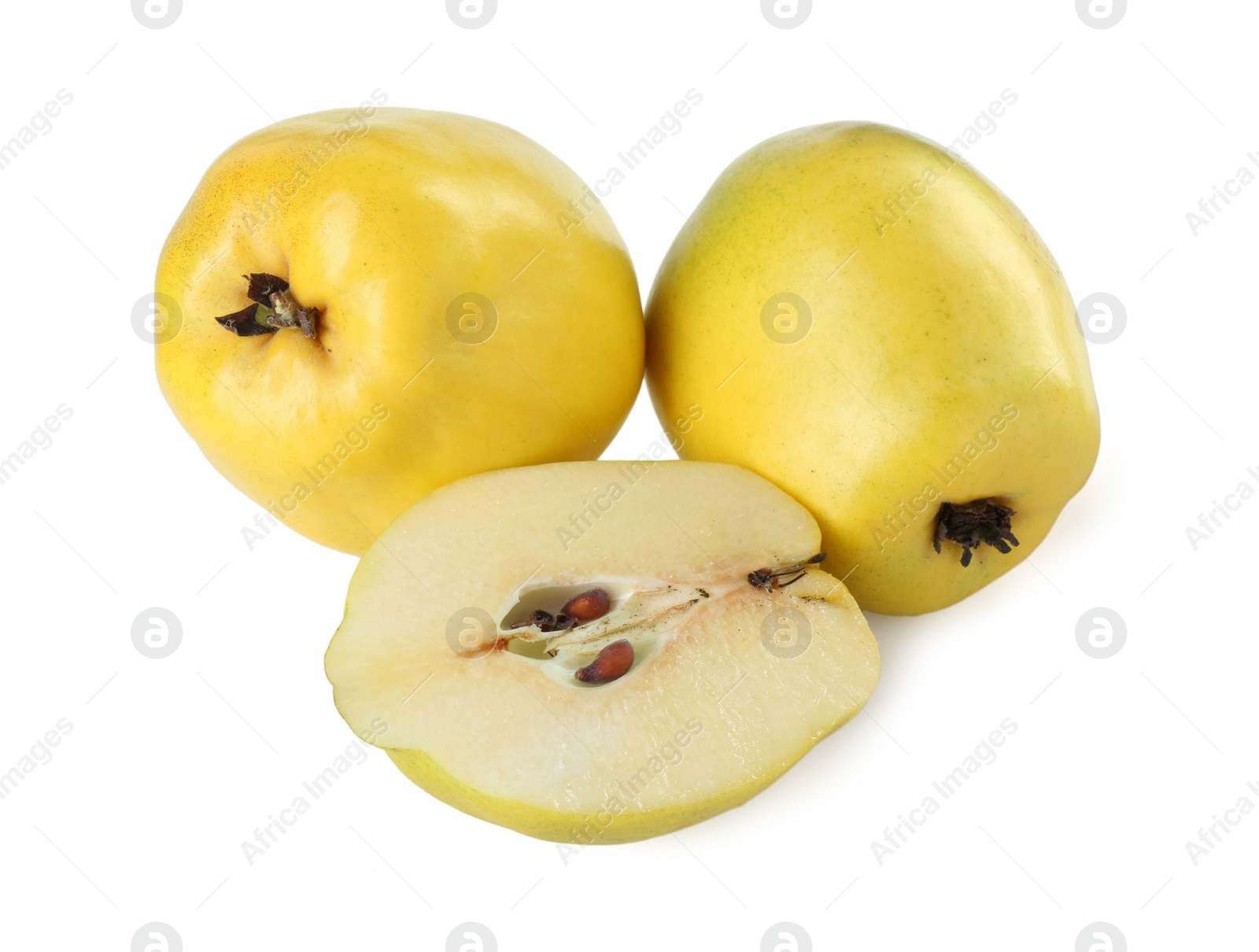 Photo of Ripe whole and cut quinces isolated on white