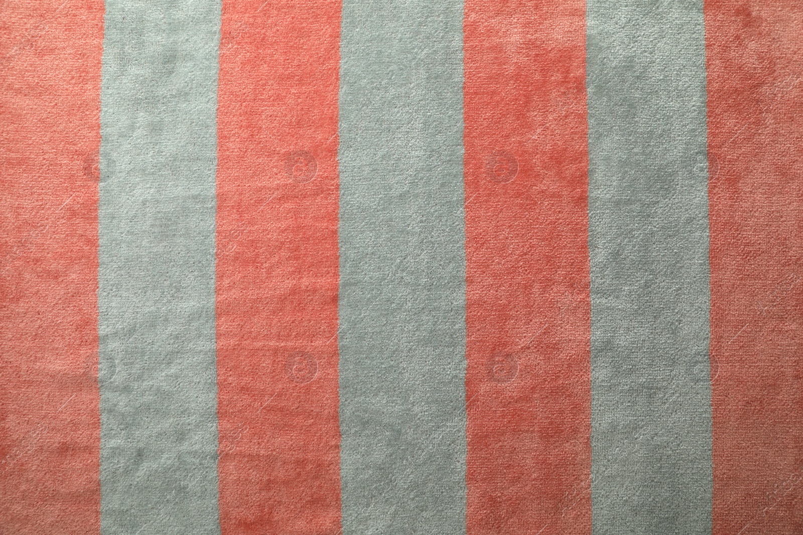 Photo of Striped beach towel as background, top view