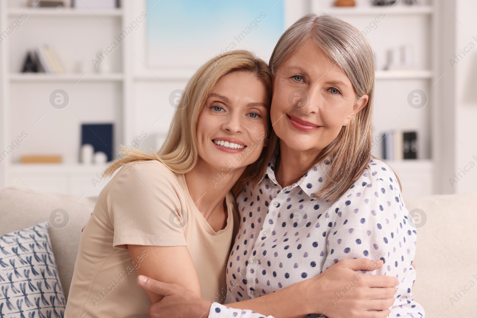 Photo of Happy mature mother and her daughter at home