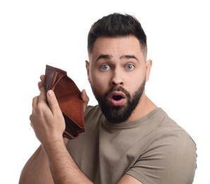 Confused man showing empty wallet on white background