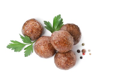 Tasty cooked meatballs with parsley on white background, top view