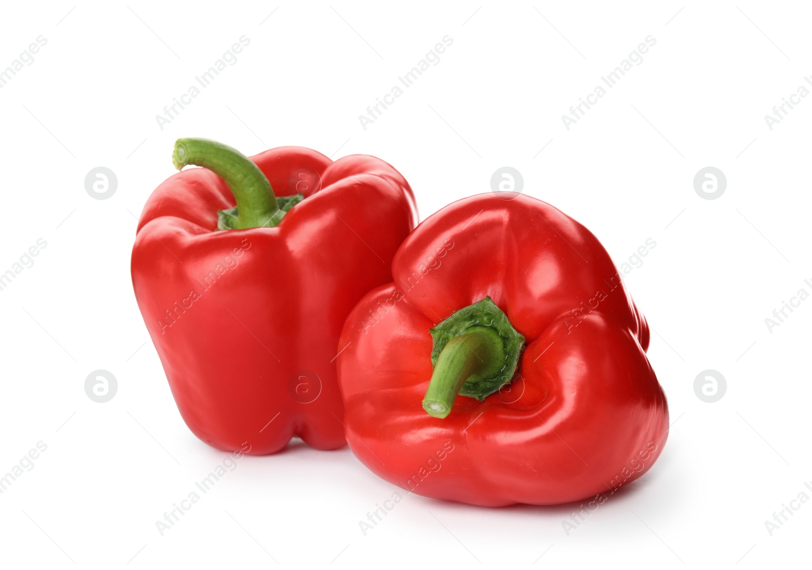 Photo of Raw ripe paprika peppers on white background