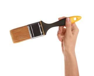 Woman holding paint brush on white background, closeup