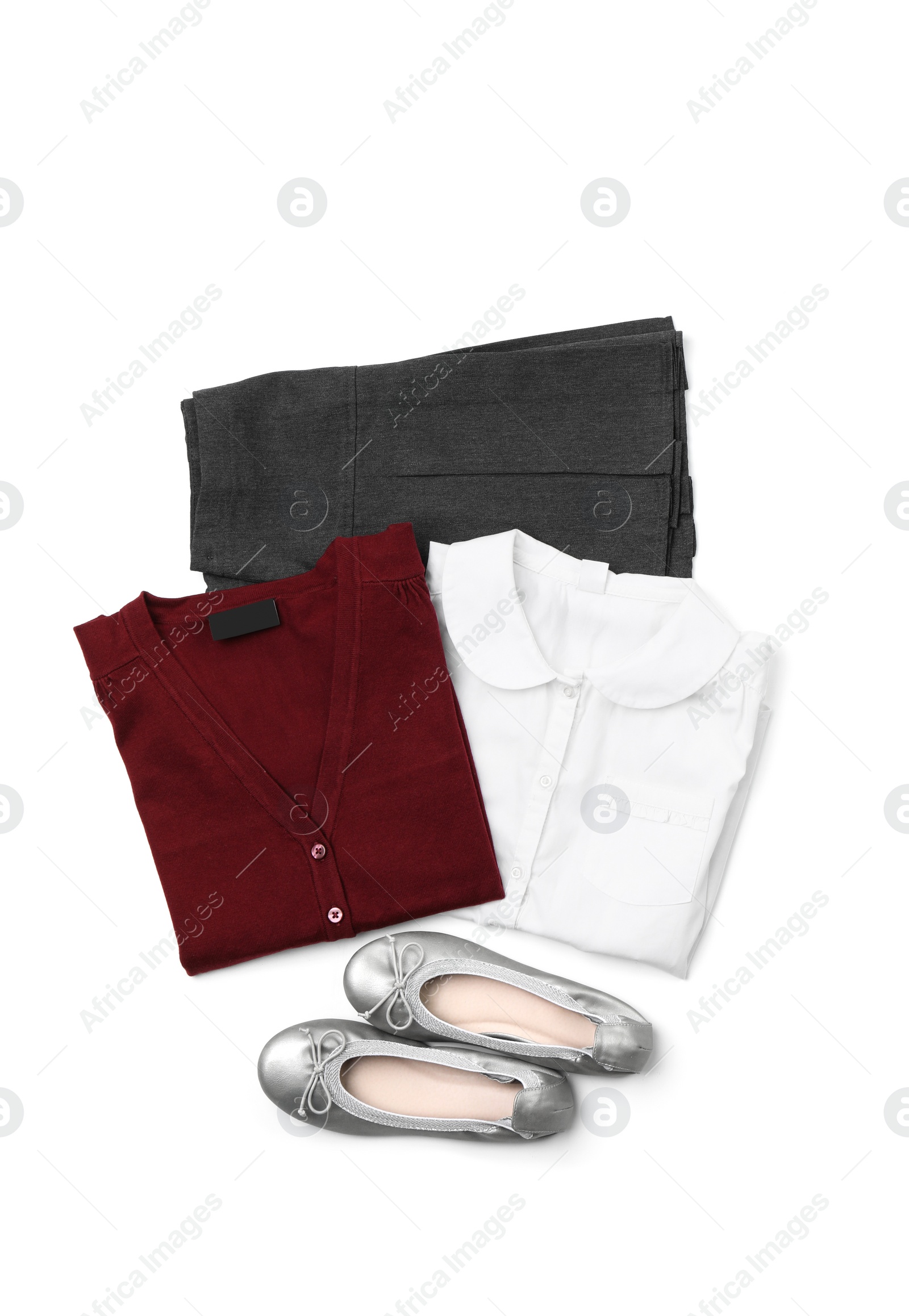 Photo of Stylish school uniform on white background, top view