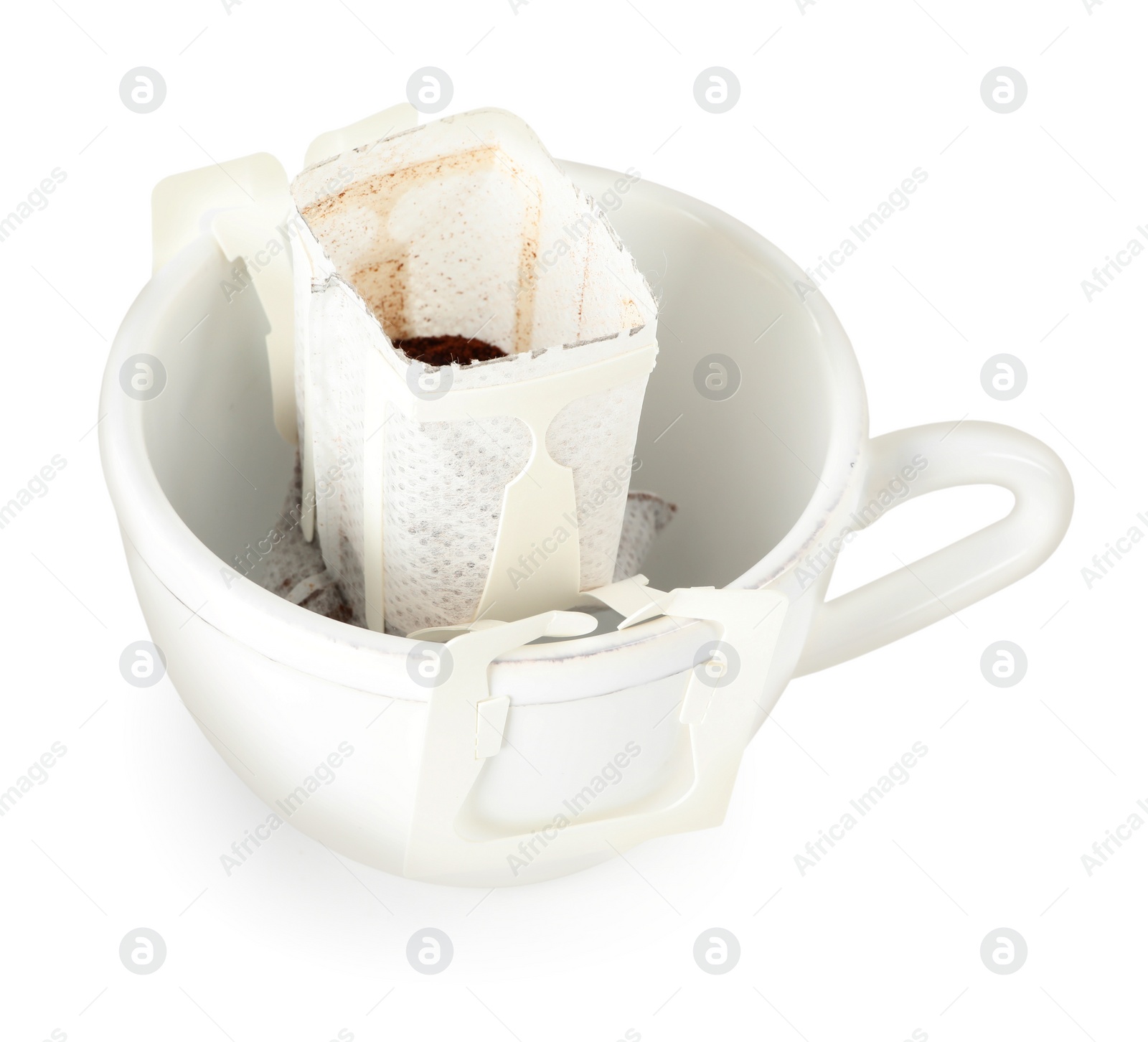 Photo of Cup with drip coffee bag isolated on white