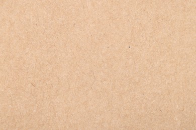 Photo of Texture of beige paper sheet as background, top view