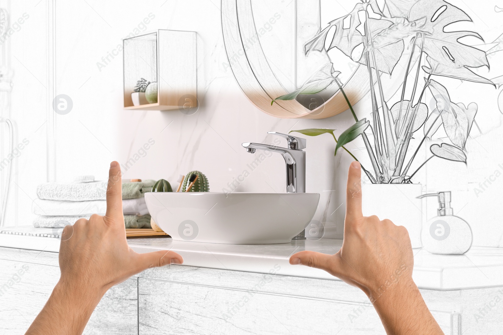 Image of Man showing frame gesture and making bathroom real out of drawing