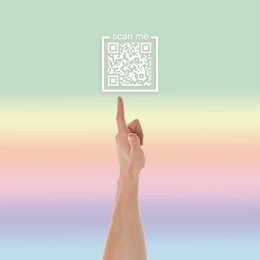 Image of Man pointing at illustration of QR code on color background, closeup