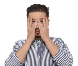 Photo of Embarrassed man covering face with hands on white background