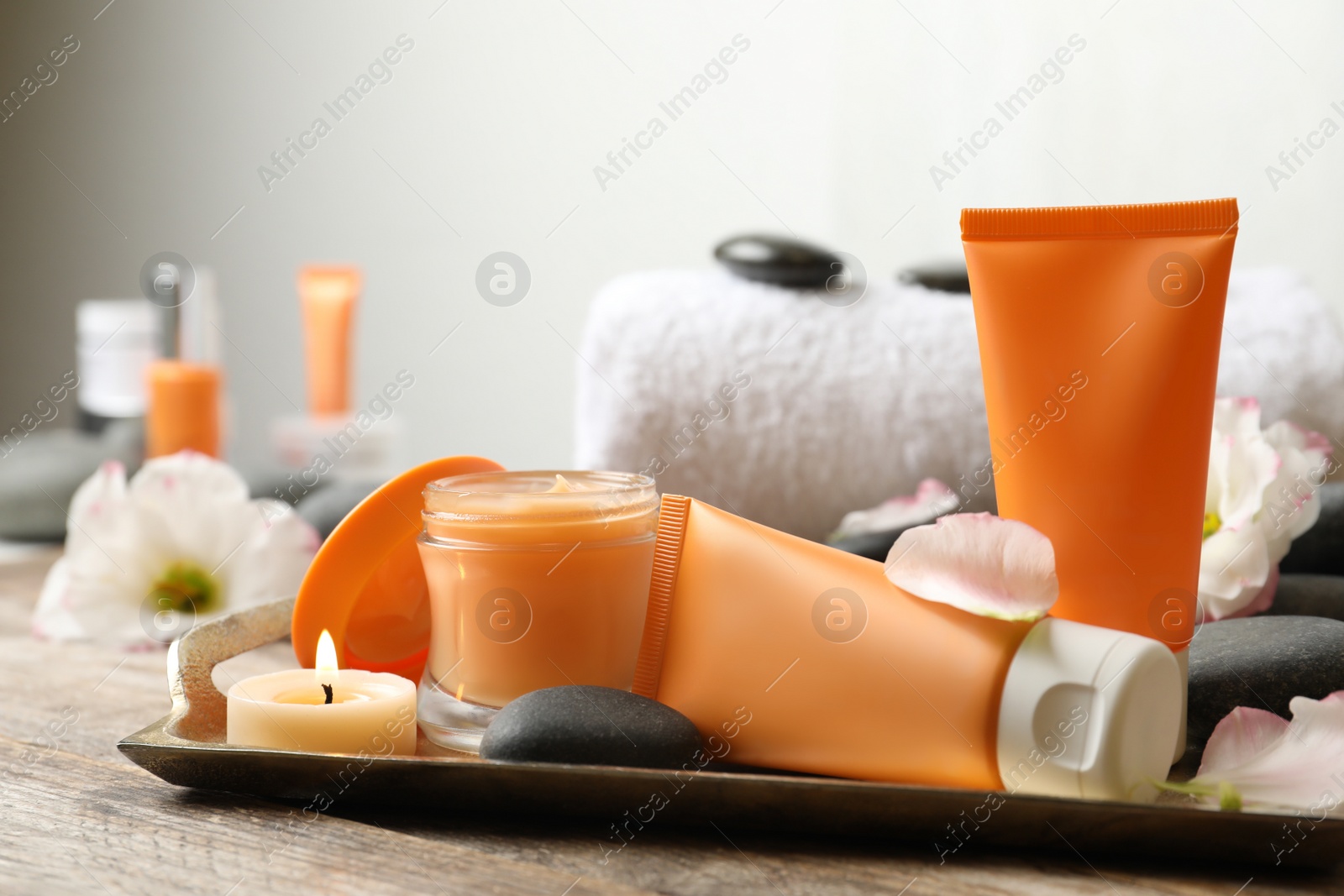 Photo of Composition with cosmetic products on wooden table