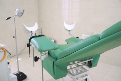 Photo of Examination room with gynecological chair in clinic