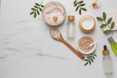 Photo of Flat lay composition with different spa products on white marble table. Space for text