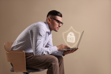 Privacy protection. Man using laptop indoors. Illustration of shield with padlock over device
