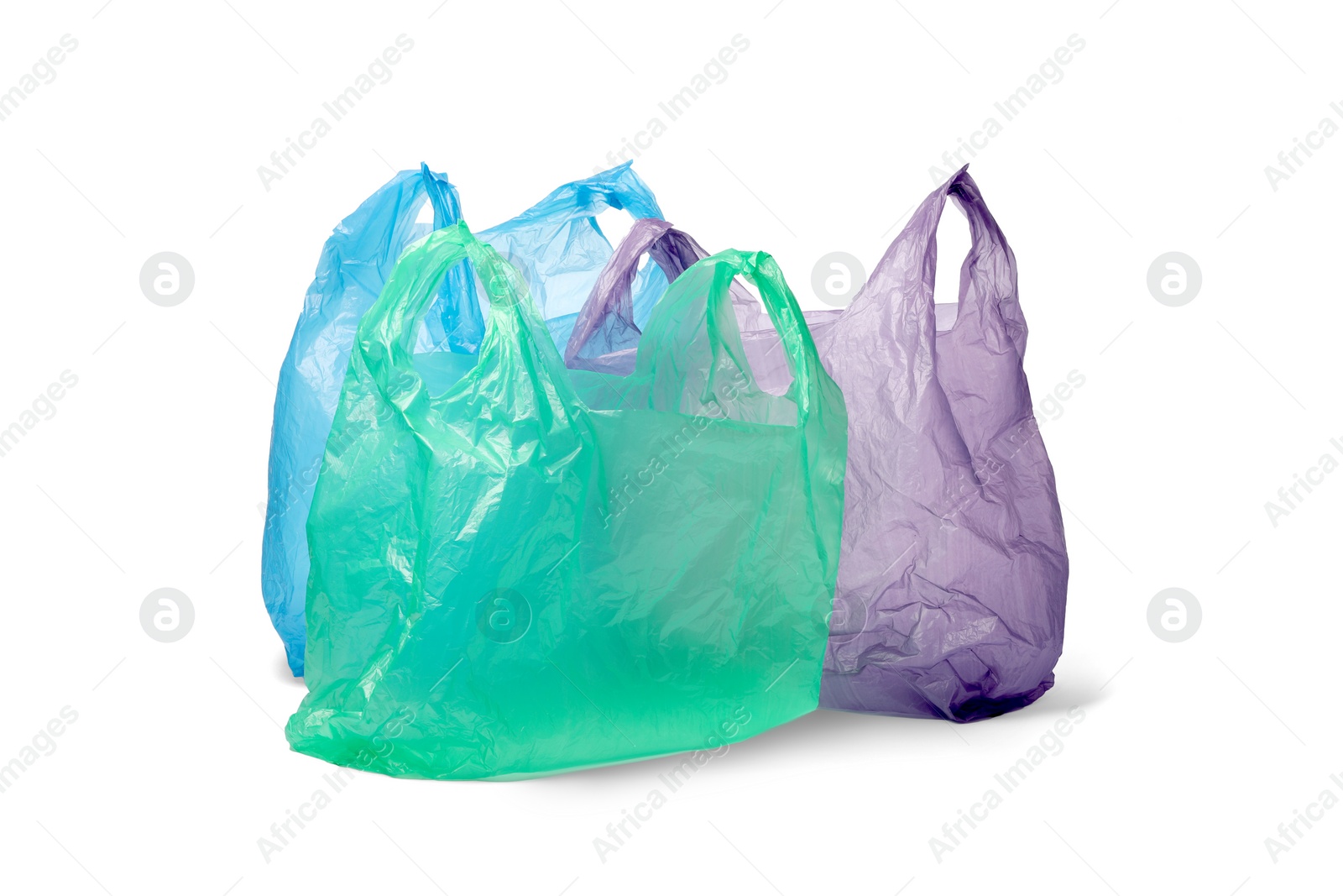 Photo of Many different plastic bags on white background