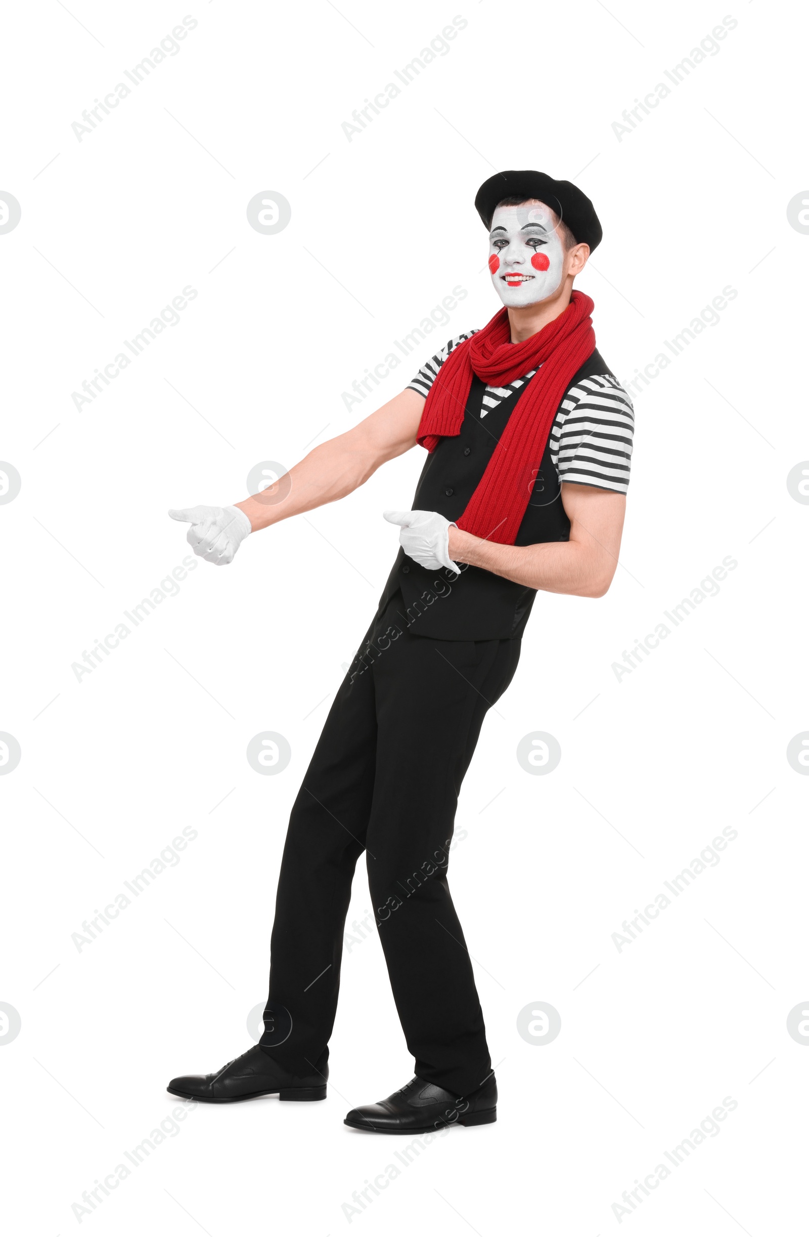 Photo of Funny mime artist in beret posing on white background