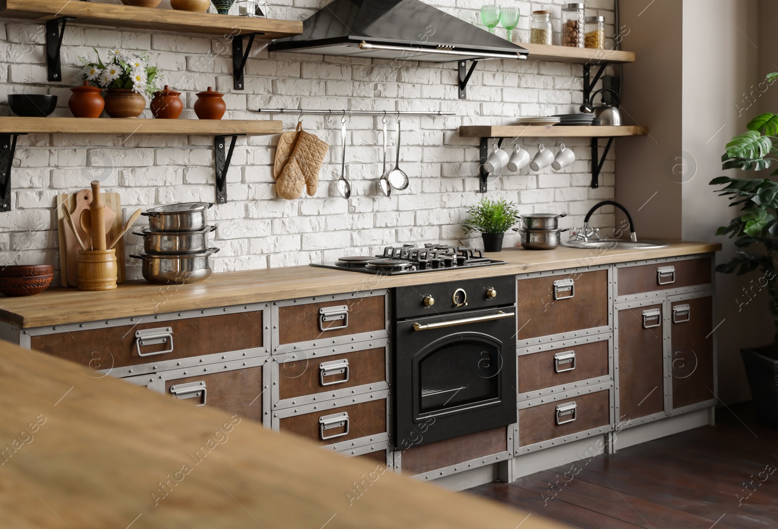 Photo of New modern oven in stylish kitchen. Cooking appliance