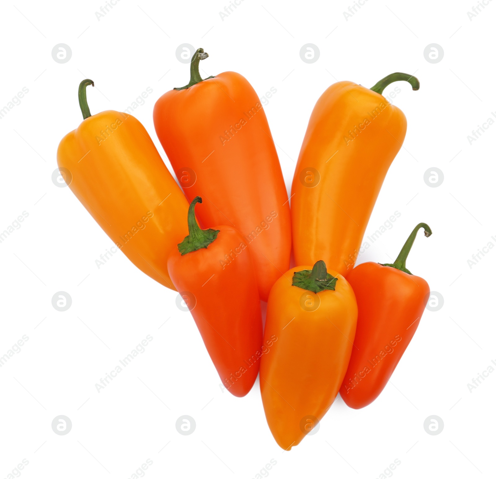 Photo of Fresh raw orange hot chili peppers isolated on white, top view