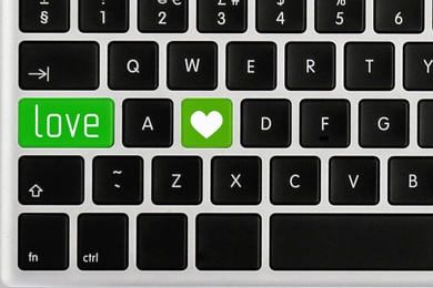 Image of Love buttons on laptop keyboard, top view. Online dating site