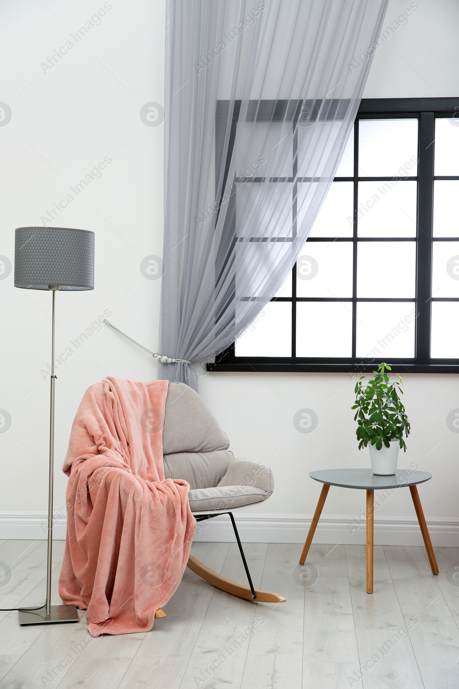 Photo of Modern furniture and window curtain in stylish room interior