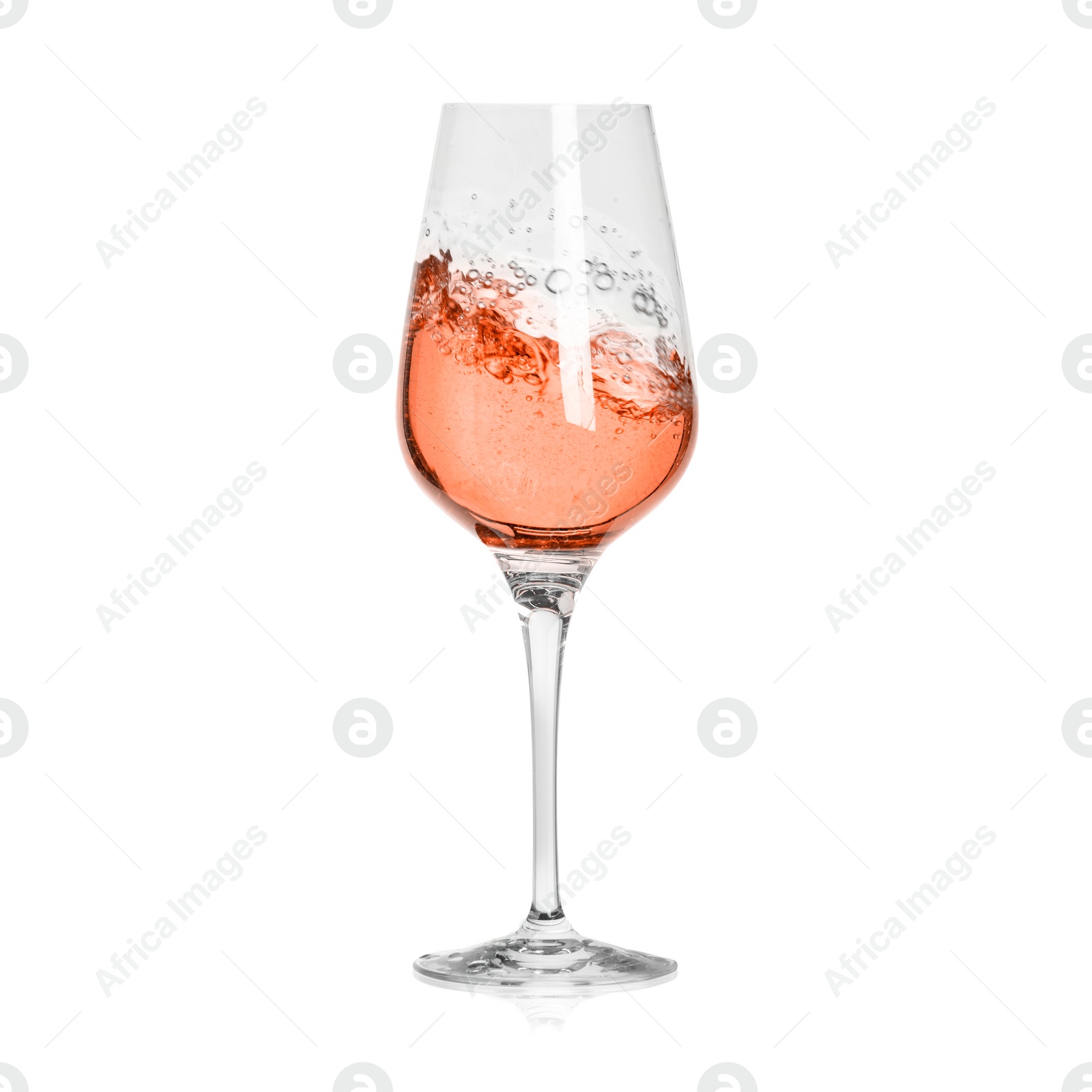 Image of Rose wine splashing in glass on white background