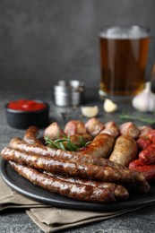 Set of different tasty snacks on dark grey table, closeup