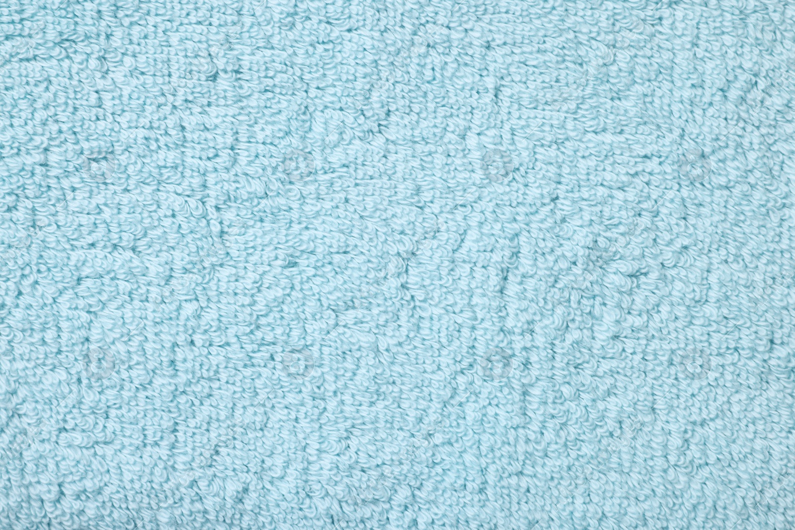 Photo of Texture of soft light blue fabric as background, top view