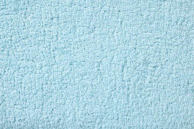 Texture of soft light blue fabric as background, top view