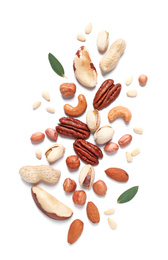 Different delicious nuts on white background, flat lay