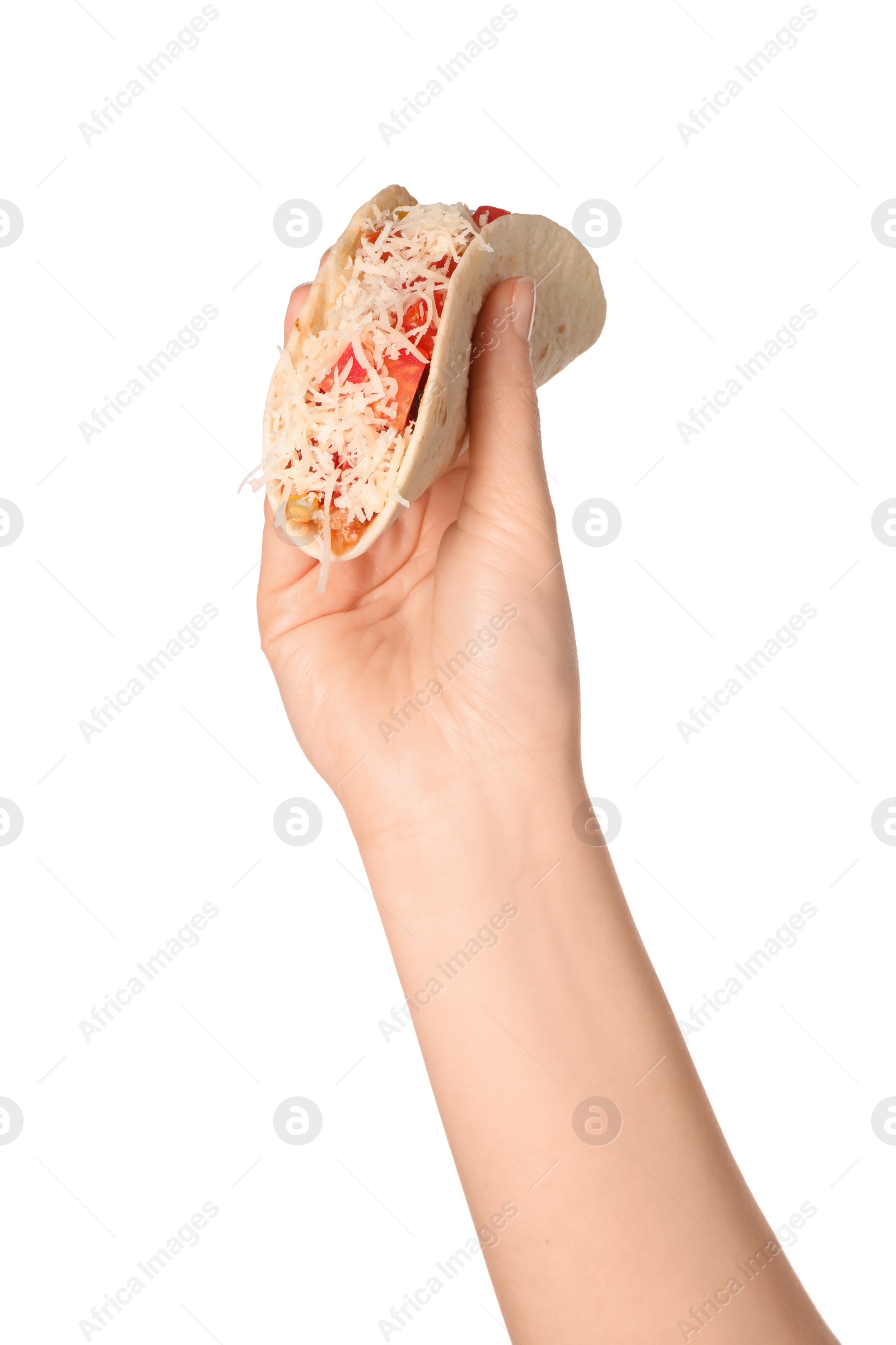Photo of Woman holding delicious taco with vegetables and cheese on white background, closeup