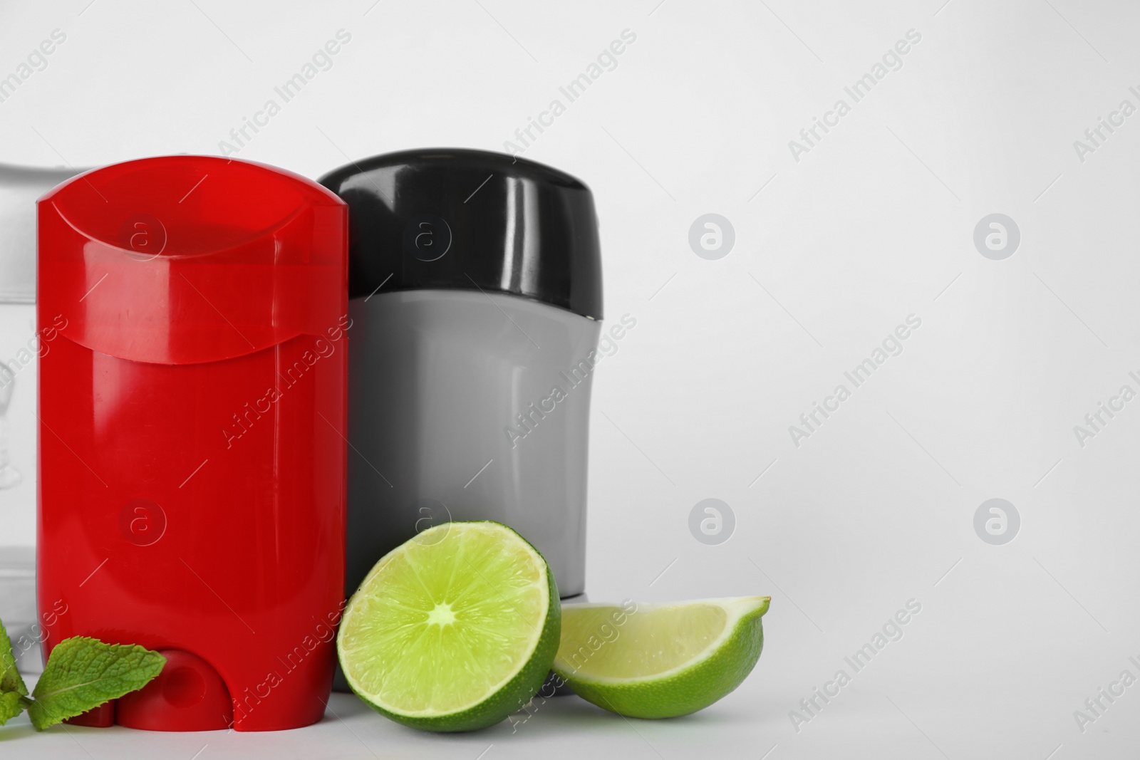 Photo of Different natural male deodorants,lime and mint on white background