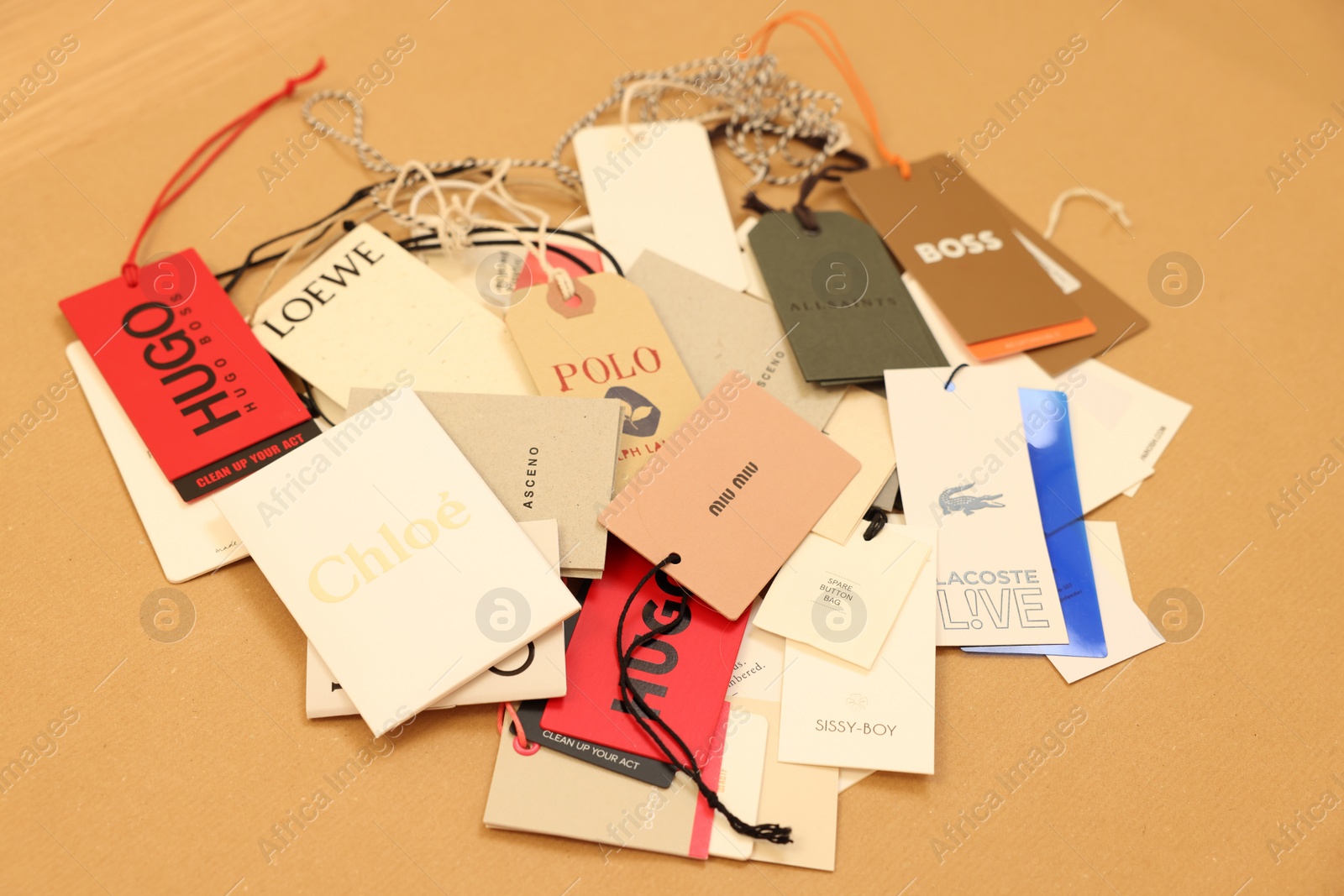 Photo of Leiden, Netherlands - December 6, 2023: Different clothing tags on kraft paper sheet