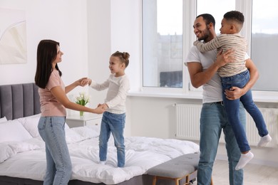 Photo of Happy international family spending time together at home