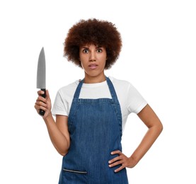 Emotional young woman in apron holding knife on white background