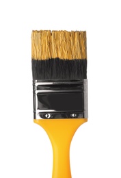 Brush with yellow paint on white background