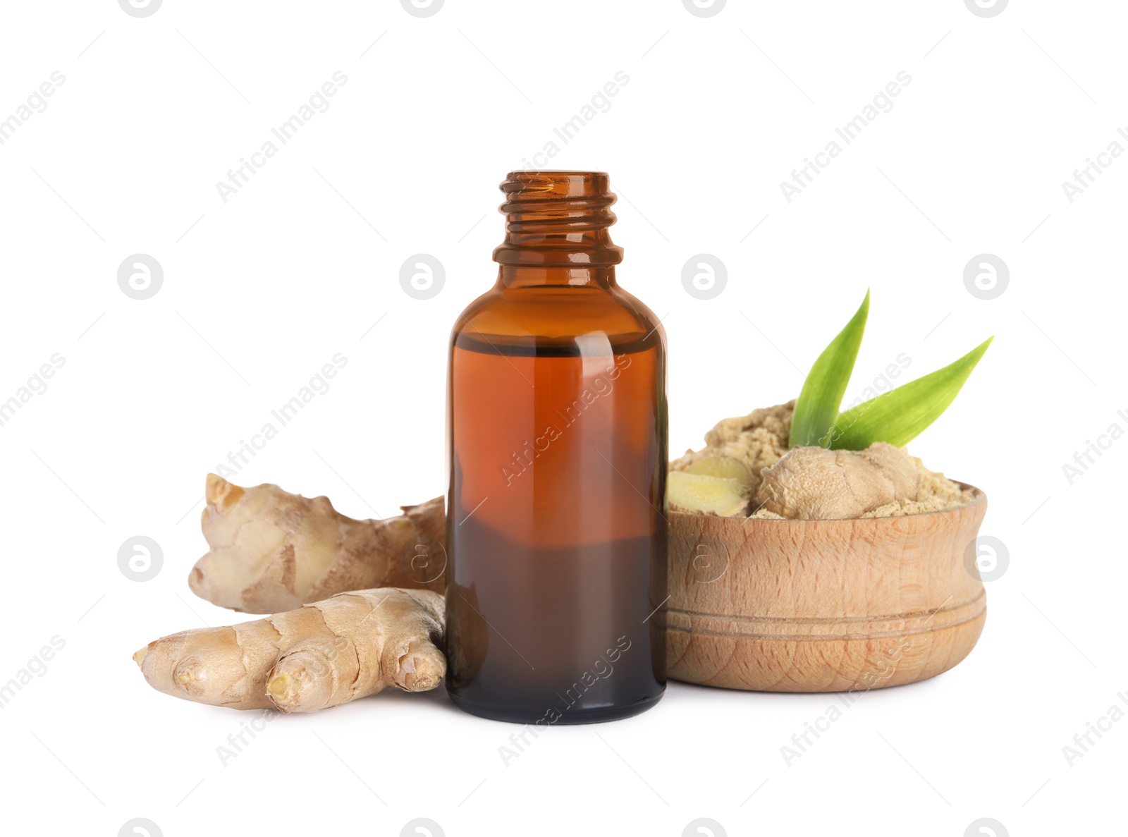 Photo of Glass bottle of essential oil and ginger root on white background