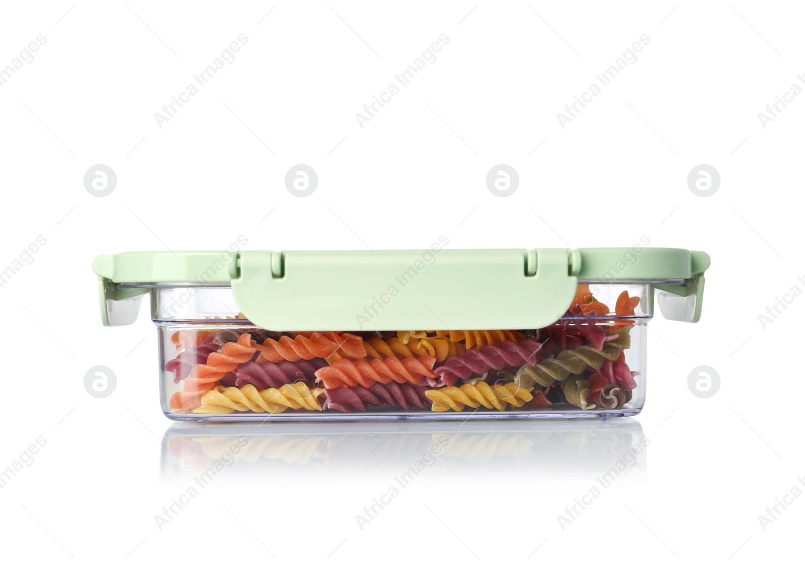 Photo of Box with uncooked pasta on white background