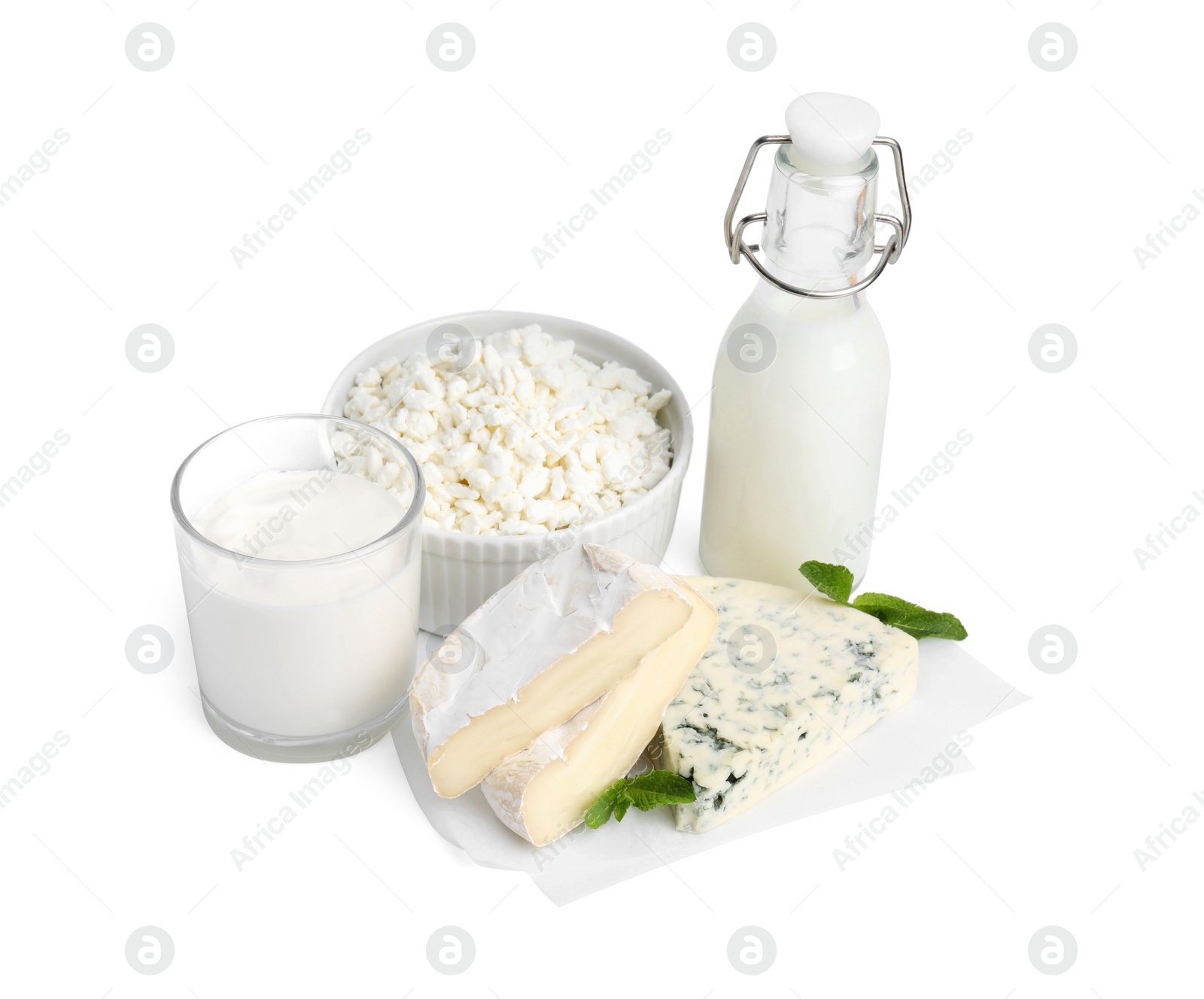 Photo of Different fresh dairy products and mint isolated on white