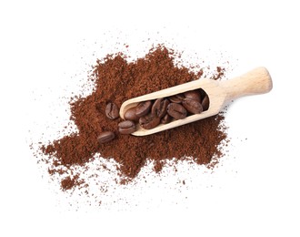 Photo of Heap of ground coffee and wooden scoop with beans on white background, top view