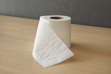 Soft toilet paper roll on wooden table