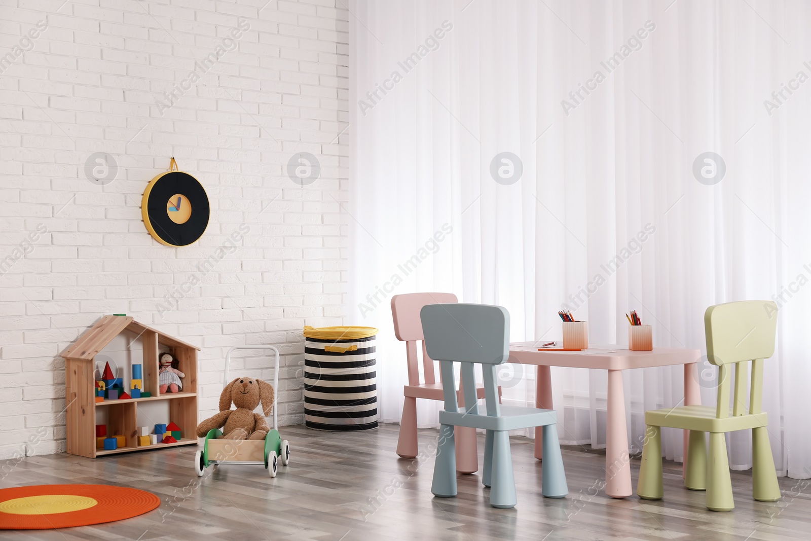 Photo of Modern child room interior with table and chairs