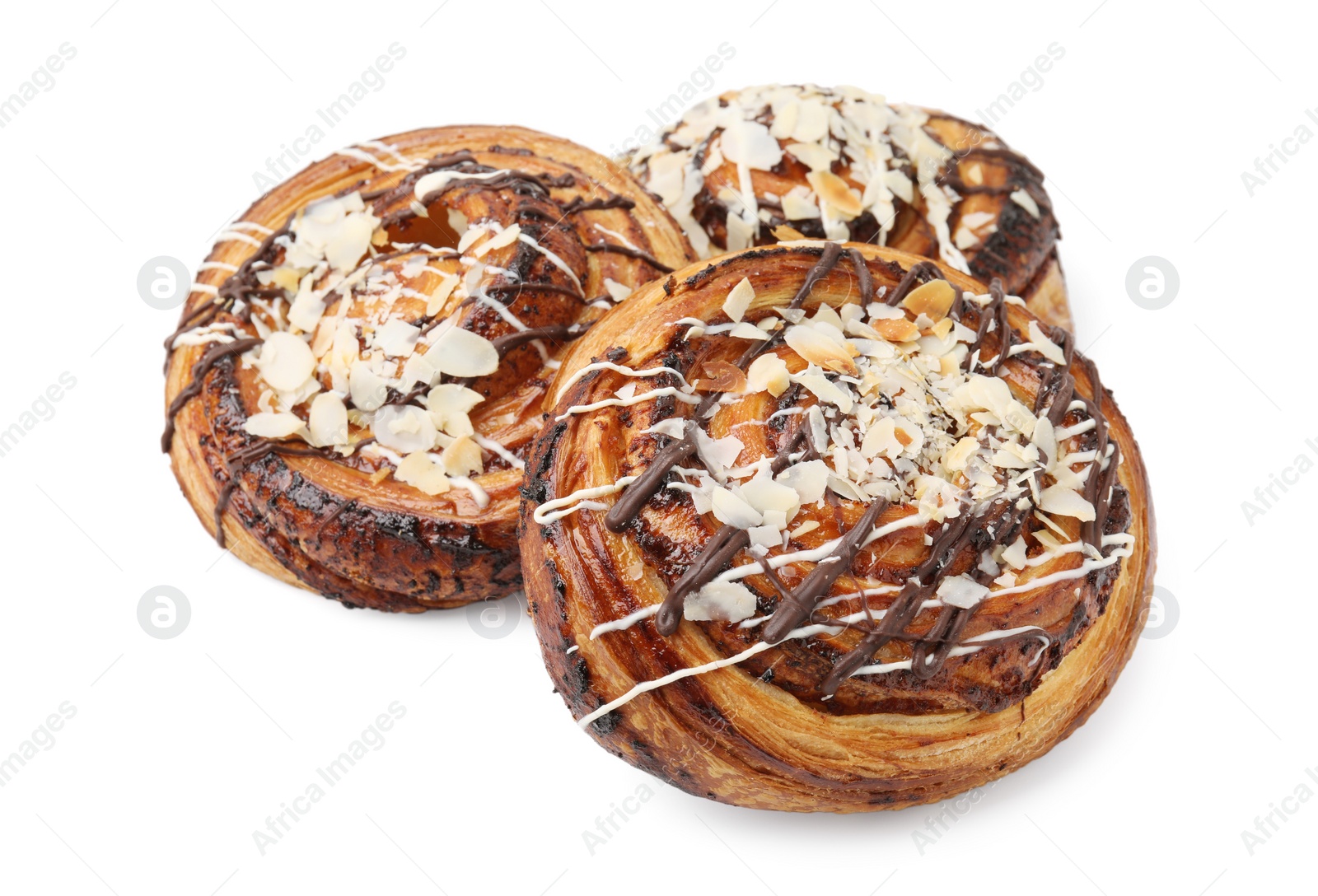 Photo of Delicious rolls with almond and toppings isolated on white. Sweet buns