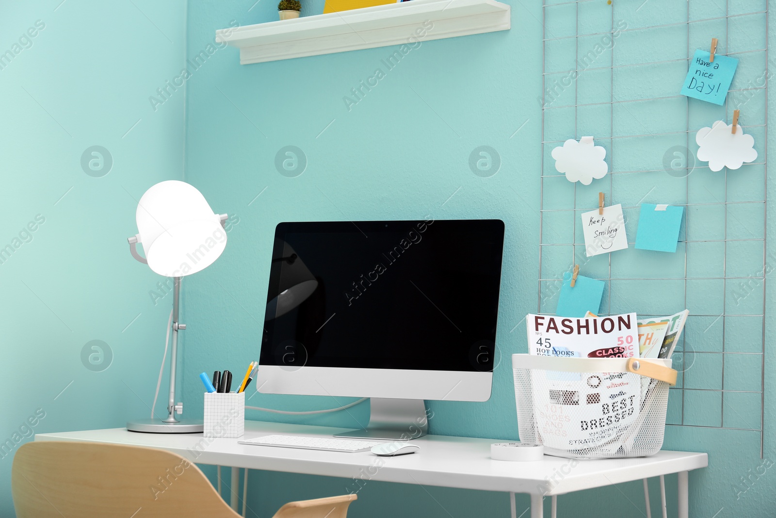 Photo of Comfortable workplace with computer on desk in home office