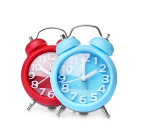 Photo of Alarm clocks on white background. Time change concept