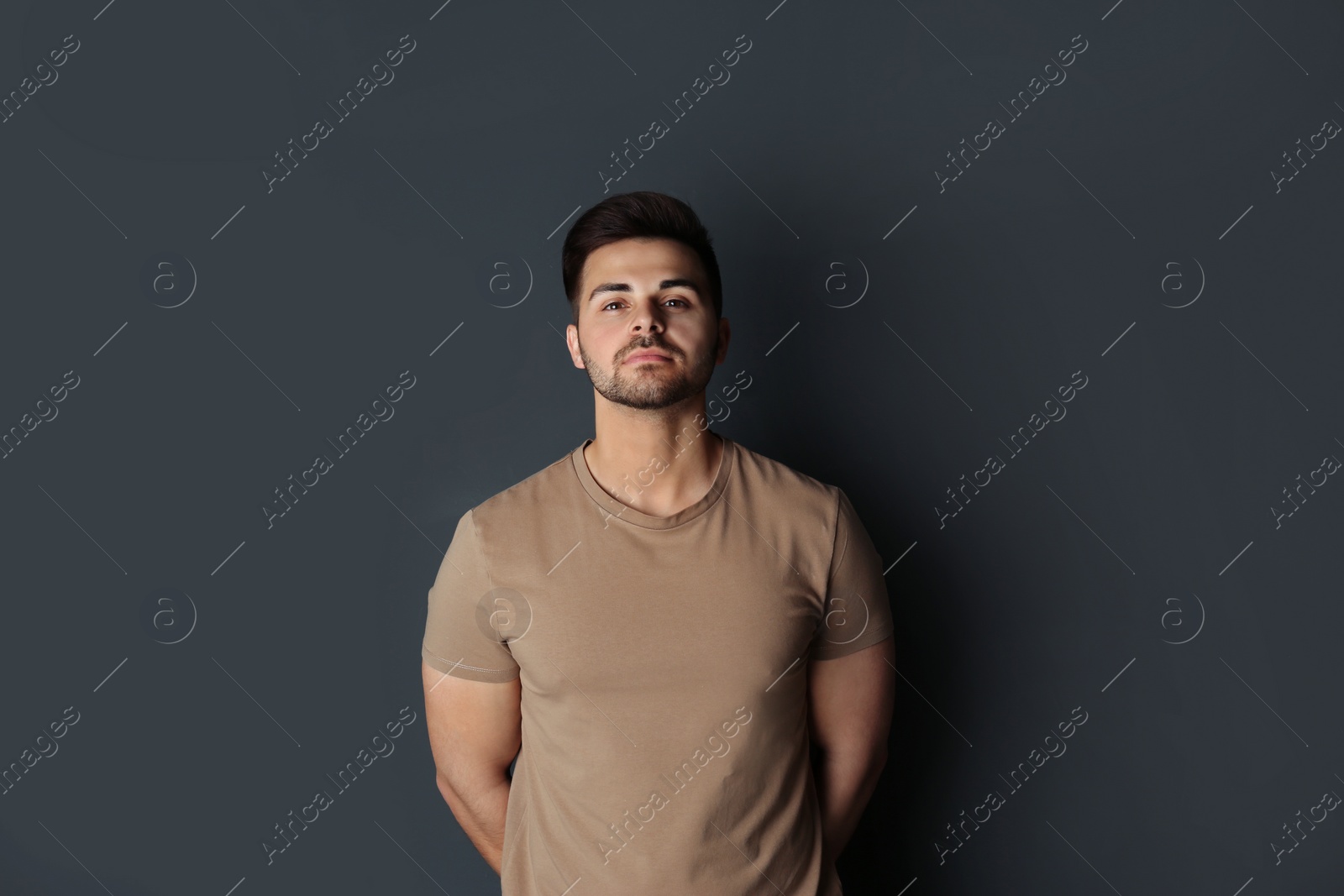 Photo of Portrait of handsome man on dark background