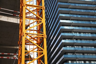 Construction site with tower crane near buildings