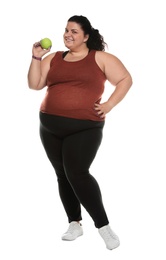 Photo of Happy overweight woman with apple on white background