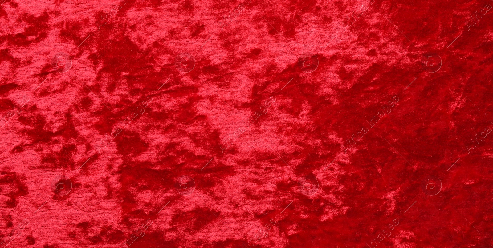 Photo of Texture of red velvet fabric as background, top view