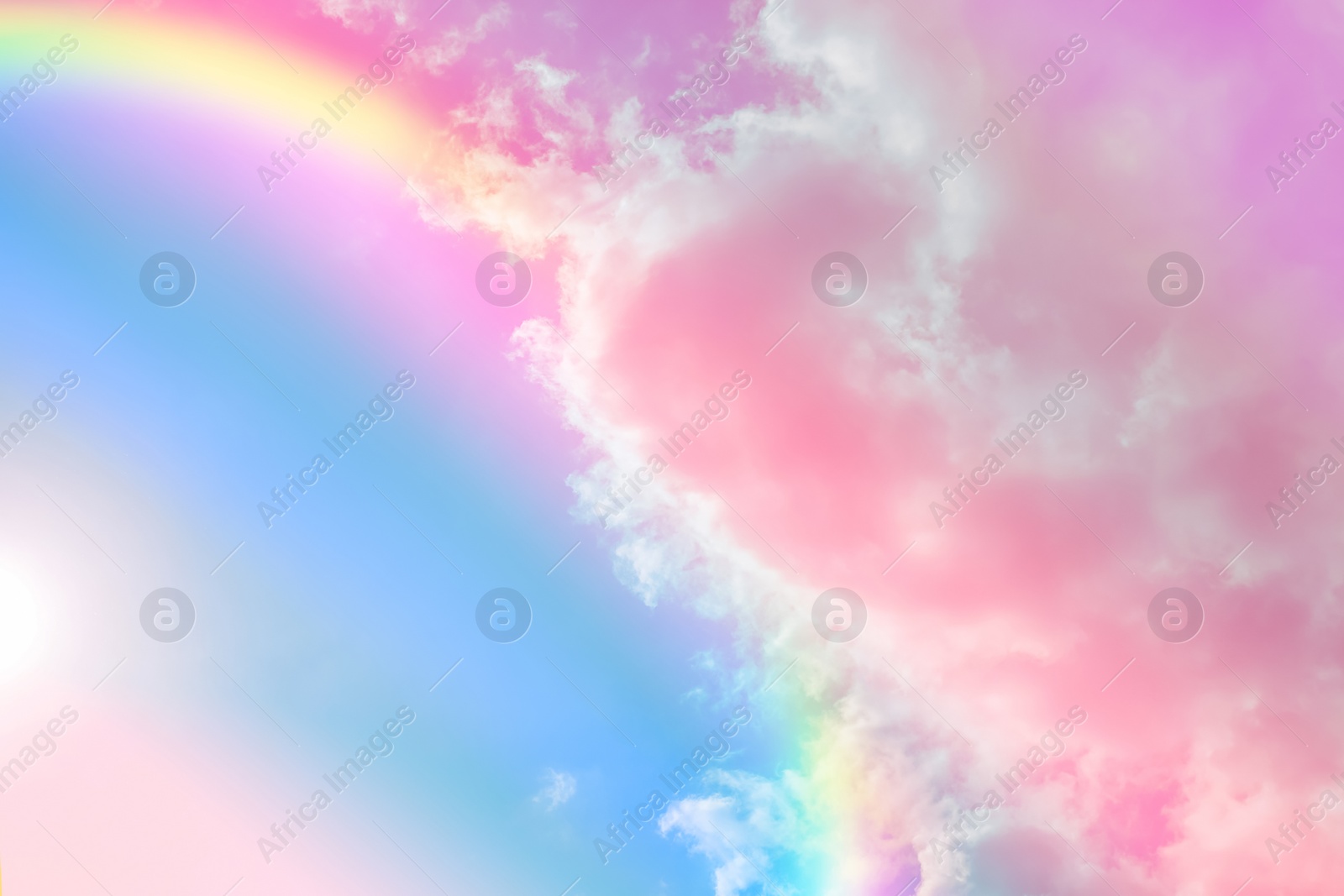 Image of Amazing sky with rainbow and fluffy clouds, toned in unicorn colors